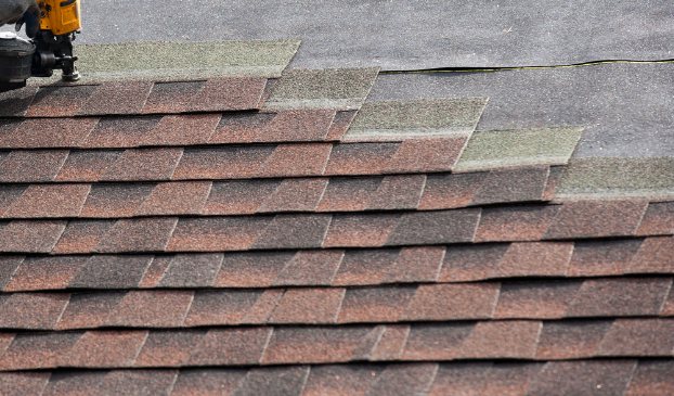 Close-up of new architectural shingle installation