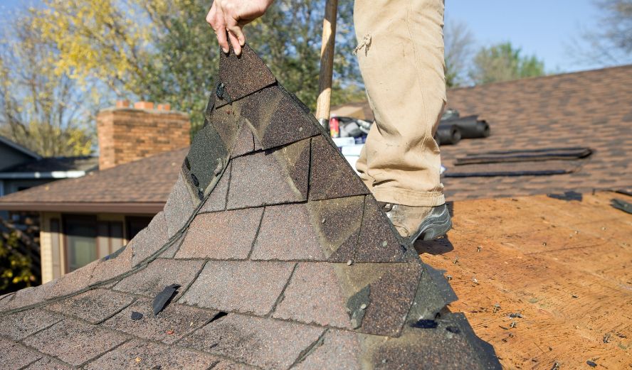 Old shingle tear-off before new roof installation