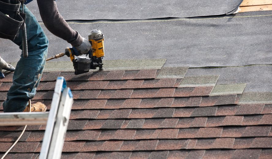 Affordable Roofer NJ crew installing new architectural shingles on a New Jersey home